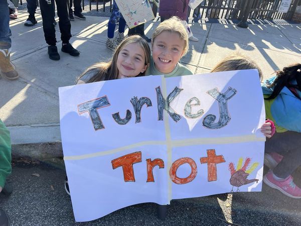 students with turkey trot sign